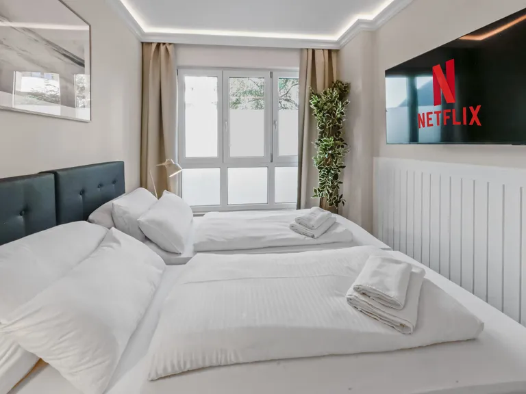 flatista homes apartments in München, Wohnung "Leon", Schlafzimmer